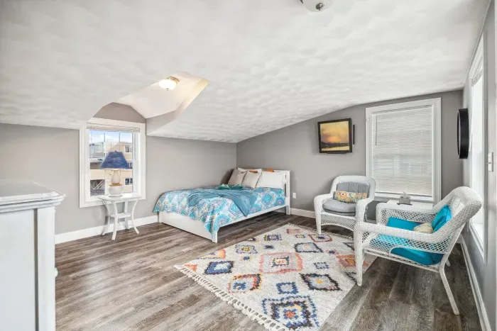 The queen bedroom located on the third floor! Access to the rooftop deck is located here. Please note there is not door to this bedroom but is the only room on this floor. Clean linens provided