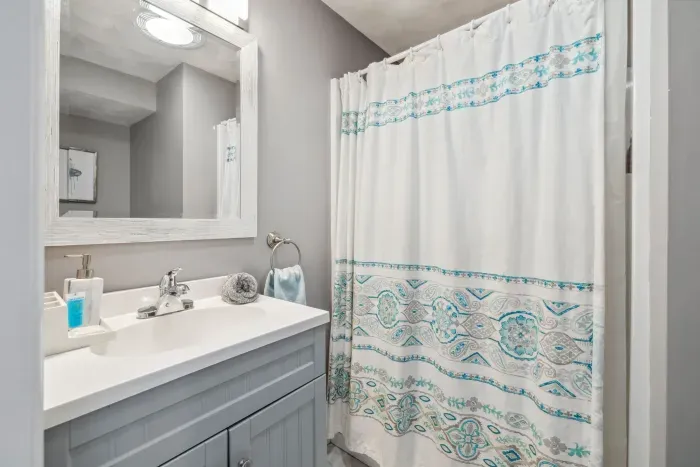 The 3/4 bathroom located on the main level. This bathroom has a standing shower only, clean towels provided for all guests!