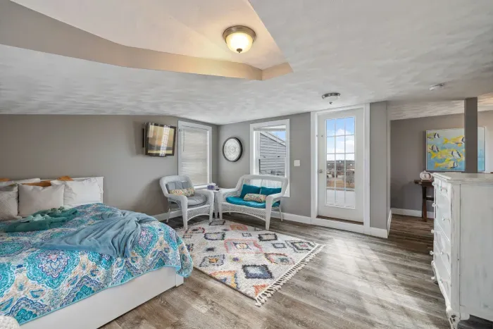 The queen bedroom located on the third floor! Access to the rooftop deck is located here. Please note there is not door to this bedroom but is the only room on this floor. Clean linens provided