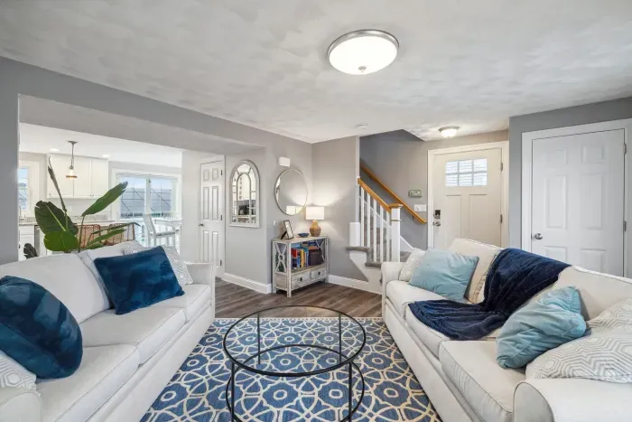 Cozy living room with a Smart TV, gas fireplace, and two comfy couches for a relaxing stay.