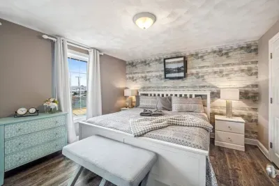 The primary bedroom with a king bed and mini split heating and cooling. Clean linens provided