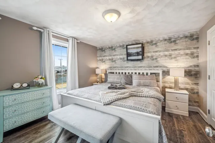 The primary bedroom with a king bed and mini split heating and cooling. Clean linens provided