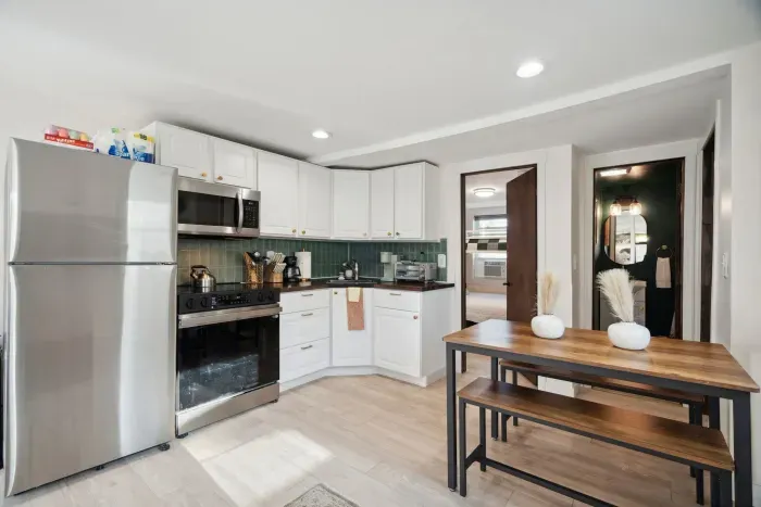 Kitchen and dining area side by side for seamless cooking and mealtime flow!