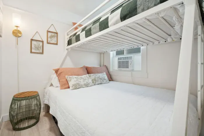 A sturdy bunk bed, perfect for a fun and cozy sleepover experience! With a full bed fit for two on the bottom and a single twin on the top. Clean linens provided.