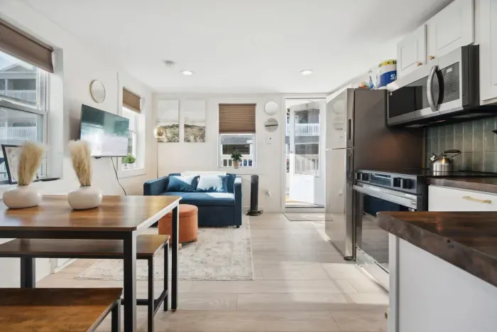 Convenient kitchen setup right across from a dining table that seats 4 —perfect for shared meals!