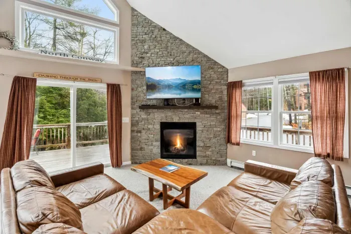 Living room with large sectional couch and gas fireplace