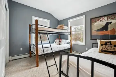 Bedroom #4 with twin-over-twin bunk bed and twin bed.