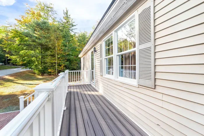 Another view of the entryway and stairs up from the driveway