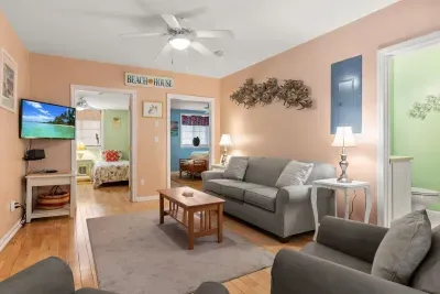 Living room: Full-size sleeper sofa with Smart TV