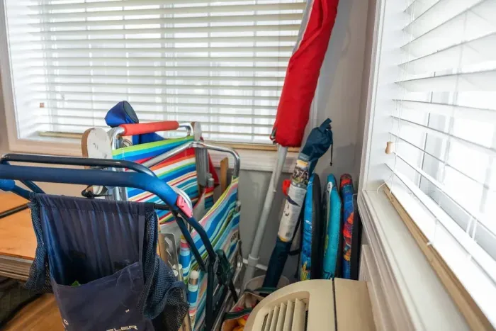 Beach essentials: cart, beach chairs, and umbrella