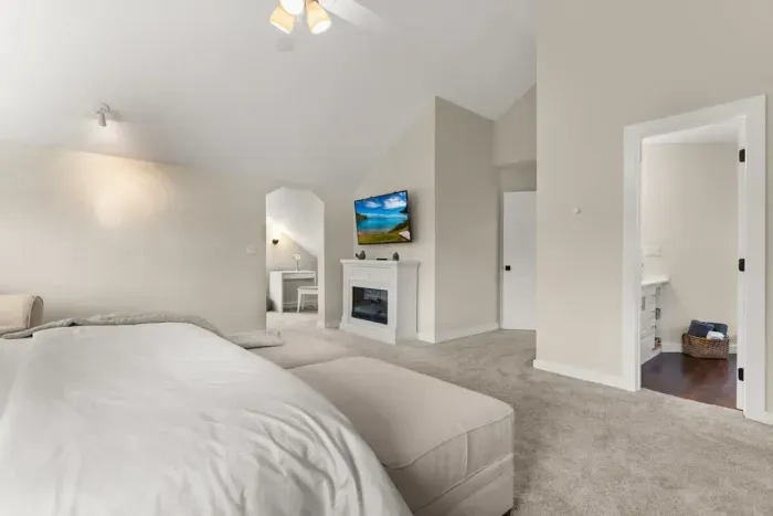 king-size bed, a flat-screen TV, an elegant electric fireplace, and a private ensuite bathroom. Enjoy a peaceful and rejuvenating sleep in this cozy haven.