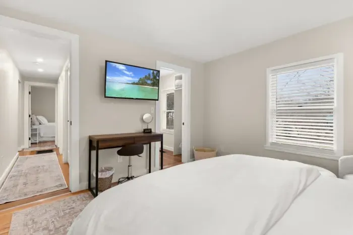 This is a cozy 1st-floor bedroom furnished with a comfortable queen-size bed.