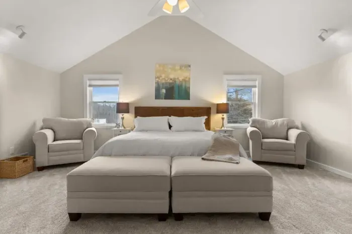 king-size bed, a flat-screen TV, an elegant electric fireplace, and a private ensuite bathroom. Enjoy a peaceful and rejuvenating sleep in this cozy haven.