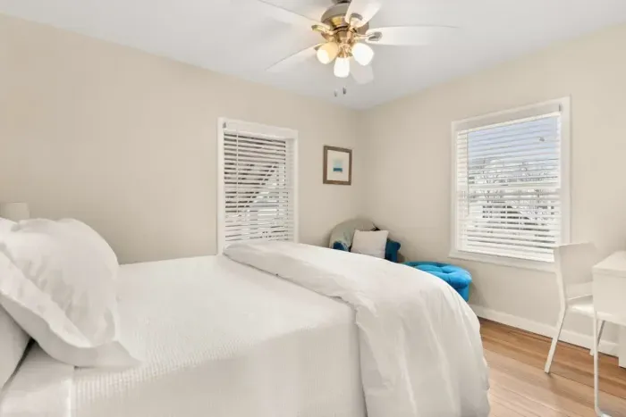 This 2nd cozy bedroom on the 1st floor features a comfortable queen-size bed and a TV, perfect for a relaxing evening after a day of exploring