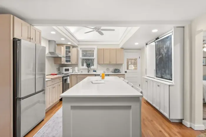 This fully equipped kitchen features stainless steel appliances, and plenty of counter space for meal preparation.