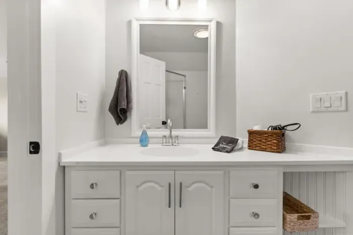 This ensuite bathroom is situated in the master bedroom and features a standing shower.