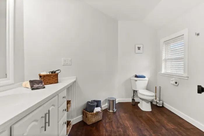 This ensuite bathroom is situated in the master bedroom and features a standing shower.
