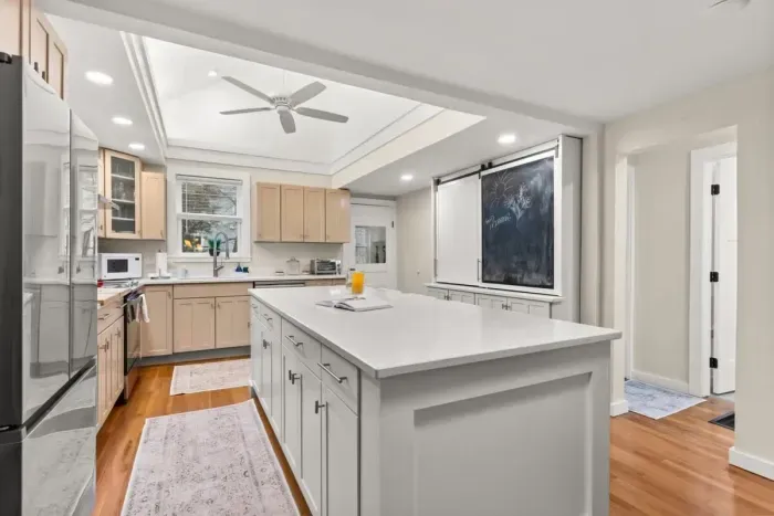 This fully equipped kitchen features stainless steel appliances, and plenty of counter space for meal preparation.