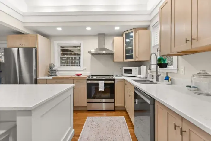 This fully equipped kitchen features stainless steel appliances, and plenty of counter space for meal preparation.