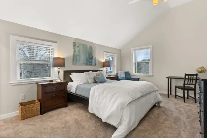 Cozy and spacious, the third bedroom is located on the second floor. It features a comfortable queen-size bed, a flat-screen TV, and a private ensuite bathroom.