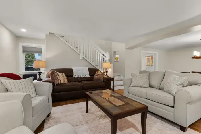 Relax and unwind in our cozy living room, complete with comfortable seating and a large TV for your entertainment.