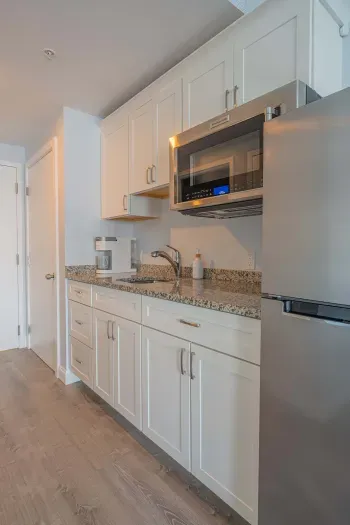 The kitchenette does not have a stovetop but it does have a microwave with a convection bake option!! Coffee is provided