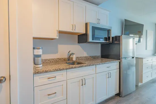 The kitchenette does not have a stovetop but it does have a microwave with a convection bake option!! Coffee is provided