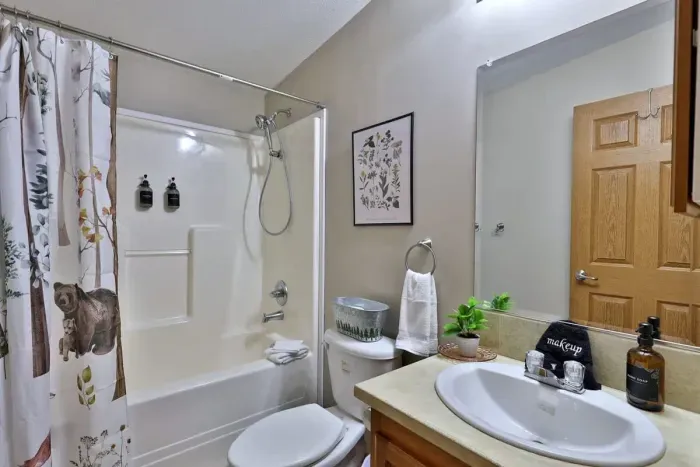 Hallway bathroom with full tub