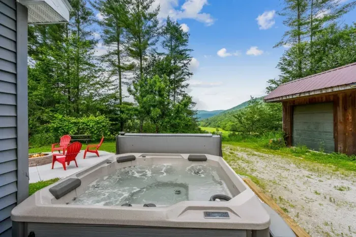 Enjoy the beautiful view of Broad Brook Valley while taking a dip in the hot tub!