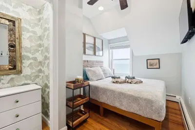 Bedroom #2 with a queen sized bed and an ocean view. Clean linens are provided.