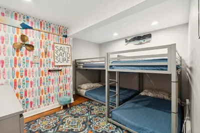 Third bedroom with 1 twin-over-twin bunk bed, 1 full-over-full bunk bed. Note: This room sleeps 4 individuals. Clean linens are provided.