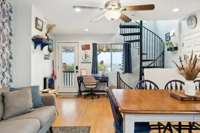 PLEASE READ: spiral staircase is the only access to the upstairs AND downstairs bedrooms. If a member of your party has mobility challenges this property may not be the best fit.