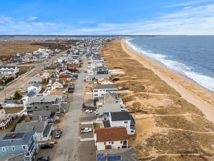 An aerial view of the home and Salisbury Beach! This property is literally across the street from the sand!