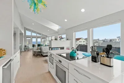 Completely renovated and fully equipped kitchen with high end Miele appliances, including an induction stove top and dishwasher. Salisbury marsh and Atlantic oceans views through the massive picture windows!
