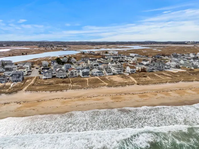 An aerial view of the home and Salisbury Beach! This property is literally across the street from the sand!