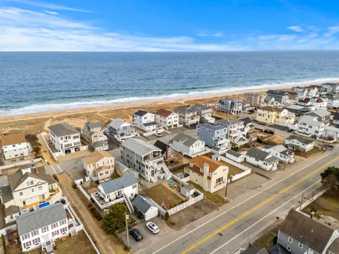 An aerial view of the home and Salisbury Beach! This property is literally across the street from the sand!