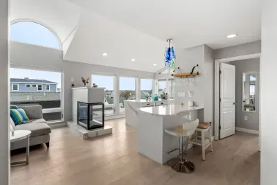 Completely renovated and fully equipped kitchen with high end Miele appliances, including an induction stove top and dishwasher. Seating for 4 at the island + 2 at the peninsula