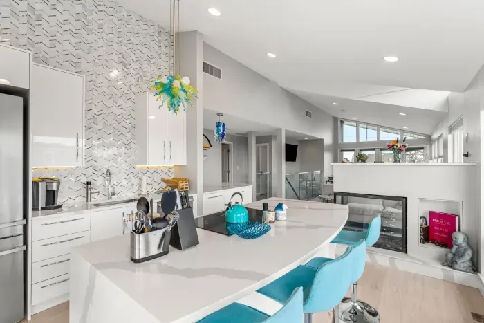 Completely renovated and fully equipped kitchen with high end Miele appliances, including an induction stove top and dishwasher. Seating for 4 at the island + 2 at the peninsula