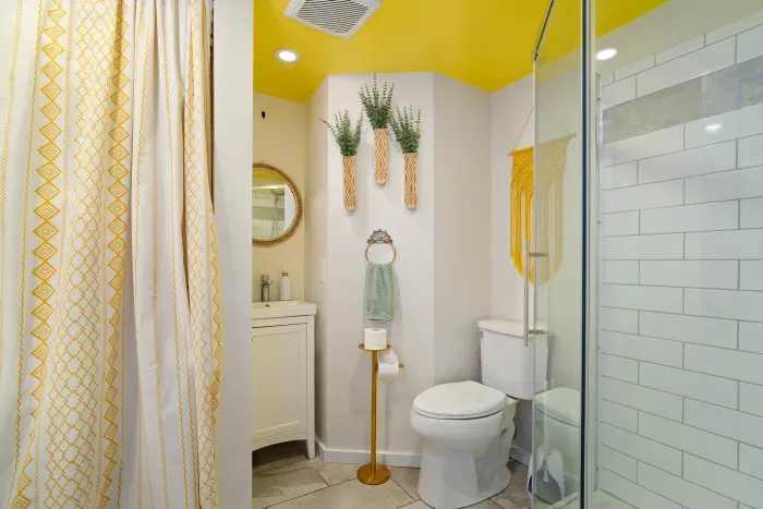 Main level bathroom with walk-in tiled shower, plus washer & dryer