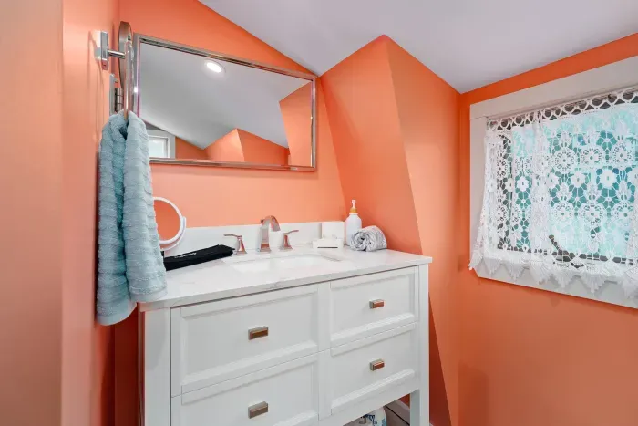 Bedroom #2 with two twin beds, mounted smart TV and ensuite bathroom with walk-in tiled shower.