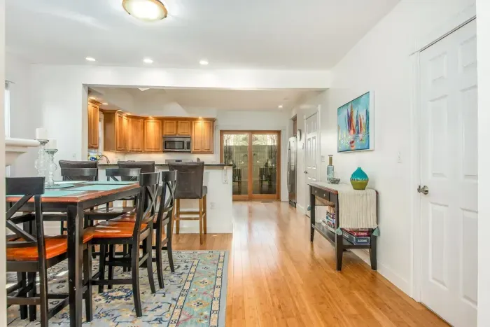 The open concept dining room and kitchen offers an abundance of space for several cooks in the kitchen and friends and family to dine. Easy access through the slider to the outdoor patio allows for additional living space.