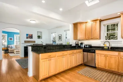 The open concept dining room and kitchen offers an abundance of space for several cooks in the kitchen and friends and family to dine. (Keurig coffee maker not available)