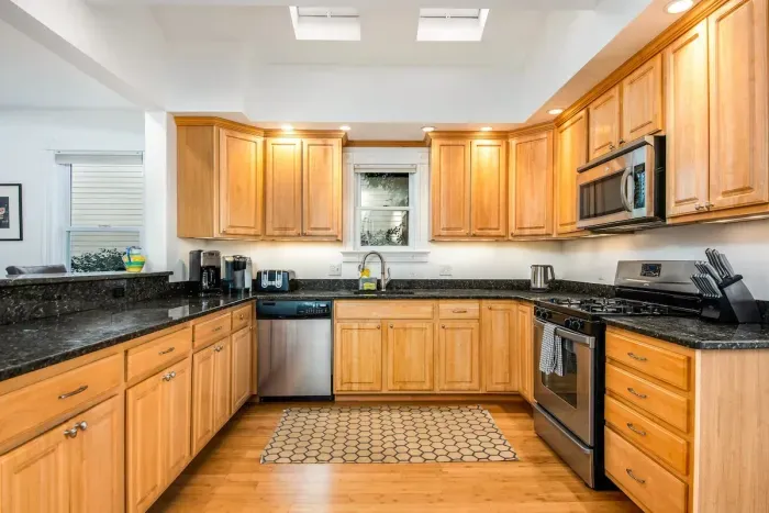 The open concept dining room and kitchen offers an abundance of space for several cooks in the kitchen and friends and family to dine. Easy access through the slider to the outdoor patio allows for additional living space.