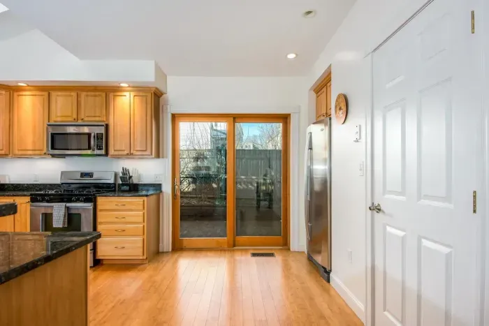 The open concept dining room and kitchen offers an abundance of space for several cooks in the kitchen and friends and family to dine. Easy access through the slider to the outdoor patio allows for additional living space.