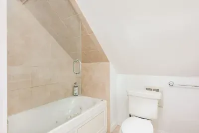 Master bathroom with tub and shower