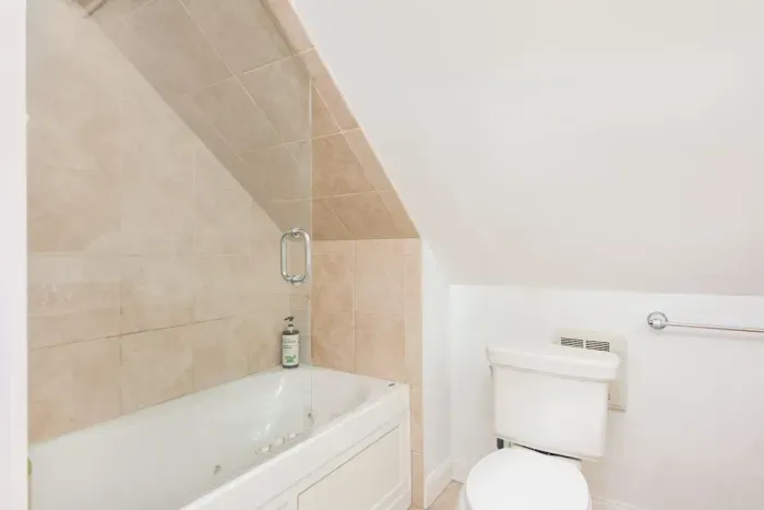 Master bathroom with tub and shower