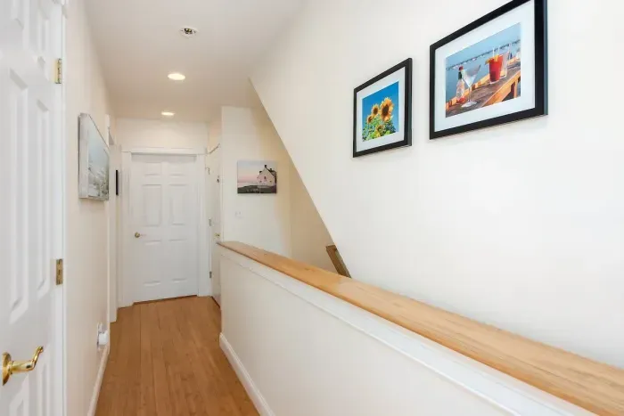 Second floor hallway to access 3 bedrooms and a full bathroom