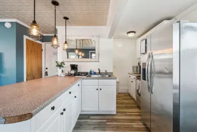 Fully equipped kitchen with all the essentials! Seating for 4 at the peninsula and seating for 6 at the dining table.