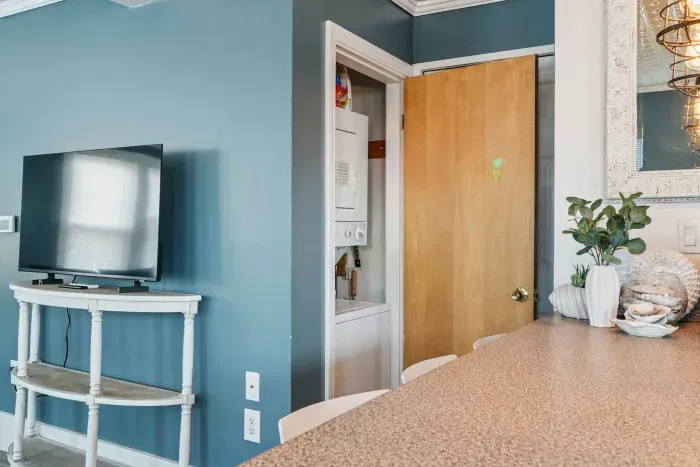 In unit laundry located in the closet by the kitchen