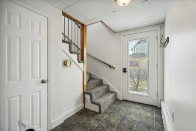 Main foyer with access to the side yard and driveway